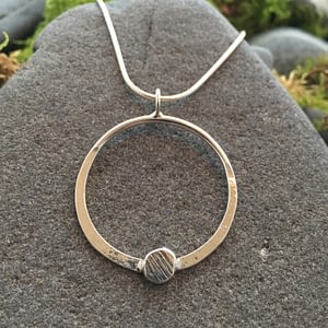 Saucy Jewelry circular luna pendant with textured metal